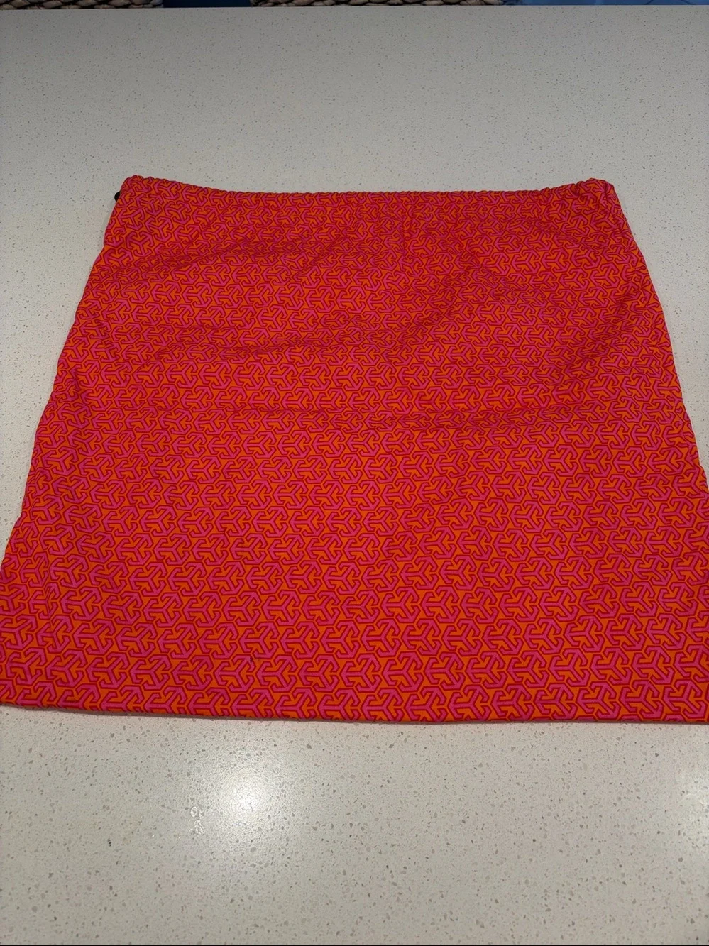 Tory Burch Pink and Orange Logo Printed dust cover bag.